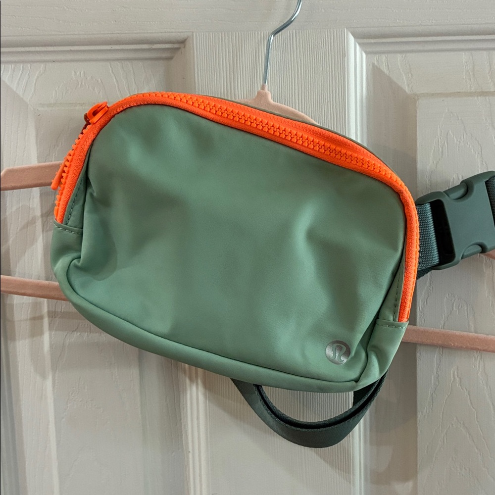 Lululemon Athletica Teal Crossbody Bag with Bright Orange Accents